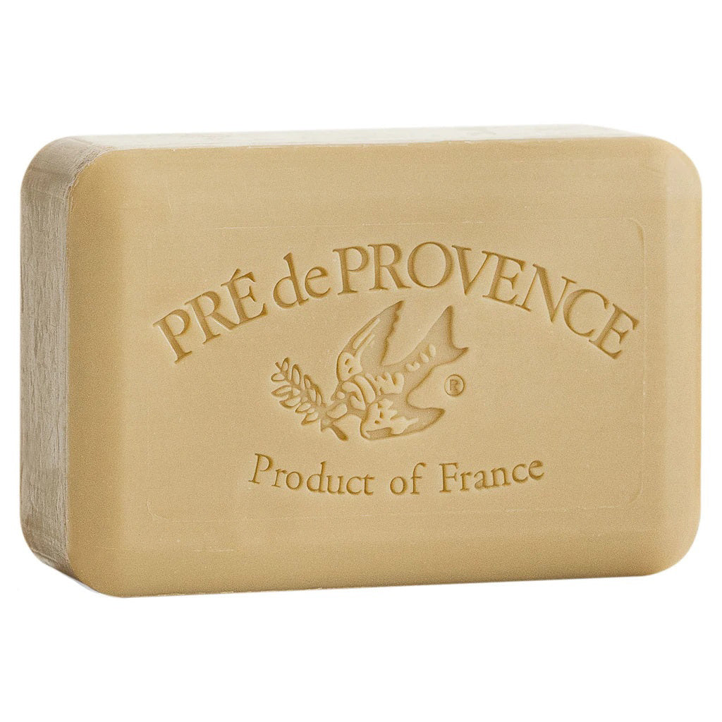 The VERBENA BAR SOAP 250G by EUROPEAN SOAPS, LLC is a beige French-milled soap enriched with shea butter, featuring the embossed text "Pré de Provence Product of France" and an image of a bird carrying an olive branch on the front. It offers aromatic fragrances.
