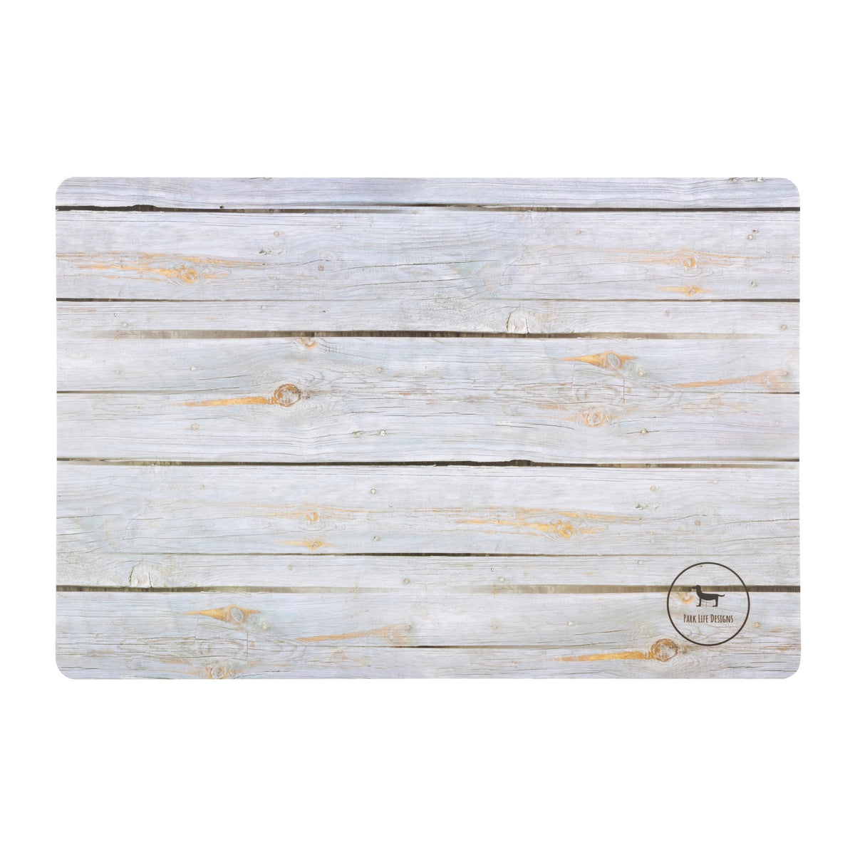 The OAXLEY PET PLACEMENT from PARK LIFE DESIGNS is a rectangular placemat with a light wooden plank design, featuring a subtle dog logo and the text &quot;THE DAILY GRIND&quot; in the bottom right corner. The rustic and weathered background gives it a charming appearance, while its waterproof material ensures easy clean-up, adding both practicality and style to your dining table.