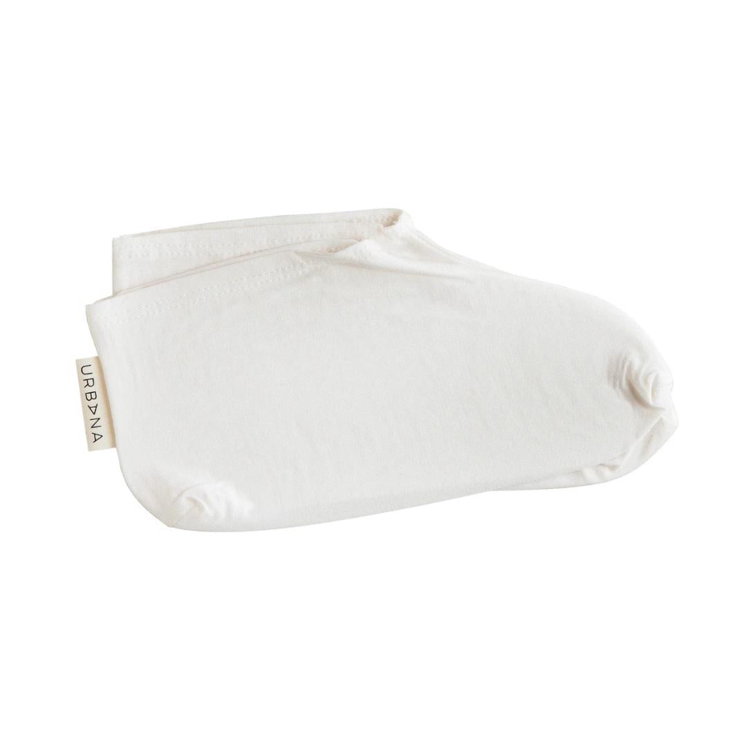 A pair of white, minimalist no-show socks branded "EUROPEAN SOAPS, LLC" with a small tag on the side reading "MOISTURIZING BOOTIES." These personal care products are folded neatly together, showcasing a simple and clean design.