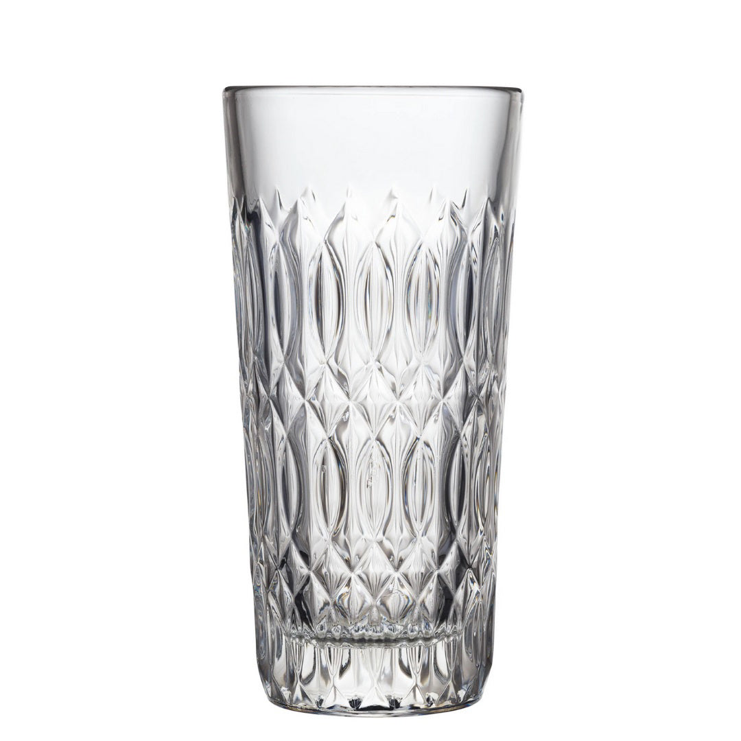 The VERONE HIGHBALL by LA ROCHERE is a transparent, tall drinking glass featuring an intricately textured diamond-cut pattern. It boasts French elegance with its wide, cylindrical shape and the La Rochere design creates a reflective, sparkling effect, enhancing its sophisticated appearance.