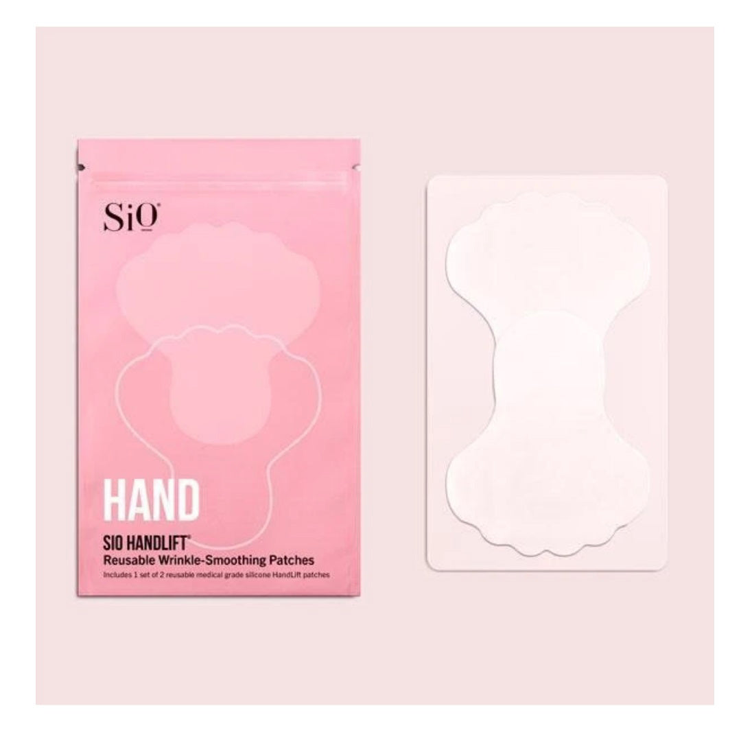 An image showing a pack of SiO Beauty&#39;s SiO Handlift Reusable Wrinkle-Smoothing Patches. The left side displays the pink packaging with the product name &quot;SIO HANDLIFT&quot; and a description. The right side features one of the translucent, medical-grade silicone patches in its packaging, designed for effective hand wrinkle treatment.