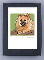 Description for PAPER RUSSELLS&#39; POMERANIAN BOXED CARDS: This charming illustration showcases a fluffy, tan-colored dog joyfully posed against a green backdrop symbolizing renewable energy, resting its paws on a brown surface.