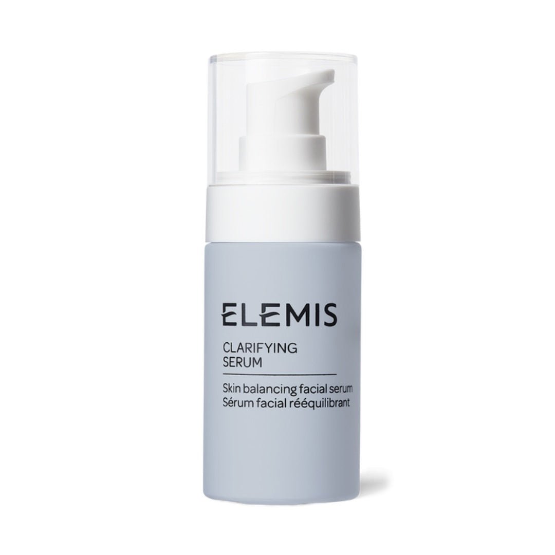 A light blue bottle of ELEMIS Clarifying Serum by ELEMIS - Steiner, featuring a white pump dispenser and a transparent cap. The label reads &quot;ELEMIS - CLARIFYING SERUM&quot; with the description: &quot;Skin balancing facial serum / Sérum facial rééquilibrant.&quot; Ideal for oily skin, it helps reduce blemishes and blackheads. The bottle is set against a white background.