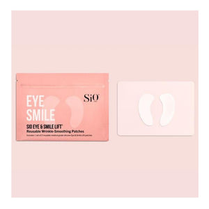 The image shows a product package labeled "SIO EYE AND SMILE" by SIO BEAUTY. The package contains "SIO Eye & Smile Lift Reusable Wrinkle-Smoothing Patches." Made from medical-grade silicone, these patches target fine lines and wrinkles around the eyes and laugh lines. Next to the package, two white, crescent-shaped patches are displayed on a light pink background.