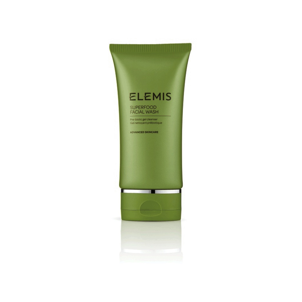 A green tube of ELEMIS - SUPERFOOD FACIAL WASH stands upright against a white background. The label on the tube reads, &quot;ELEMIS - SUPERFOOD FACIAL WASH, Pre-Biotic gel cleanser,&quot; and &quot;Advanced Skincare.&quot; This vitamin-rich Superfoods cleanser by ELEMIS - STEINER features a darker green cap.