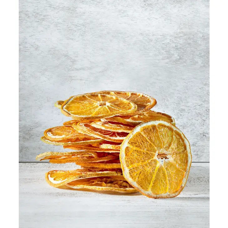 A clear plastic bag of DARDIMANS - CRISPY ORANGE SLICES by DARDIMANS CALIFORNIA CRISPS stands upright on a light surface—vitamin-rich snacks made from premium California oranges.