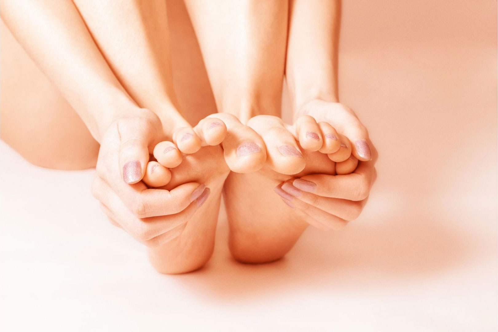 hands touching feet