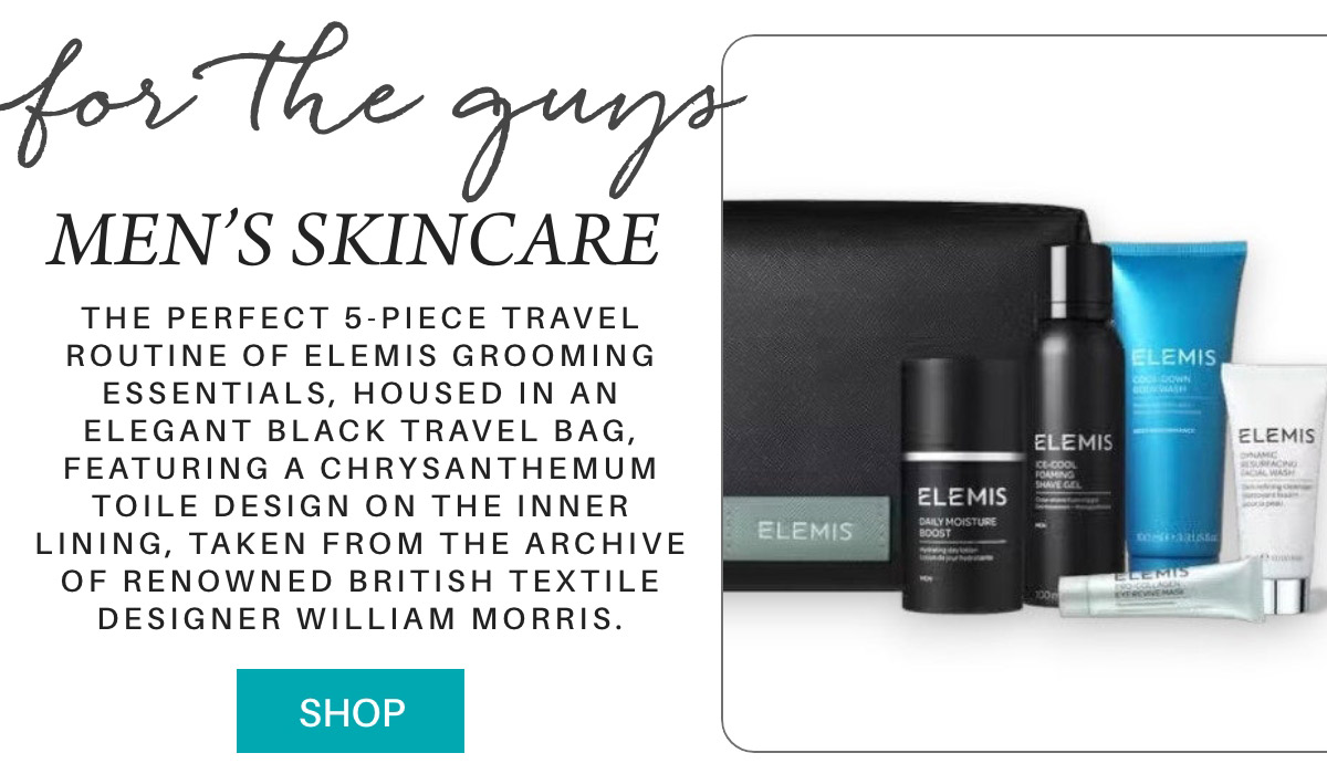 An advertisement for a men's skincare set by Elemis. The image shows a black travel bag and five skincare products. Text reads: "For the guys, Men's Skincare. The perfect 5-piece travel routine...designer William Morris." A "Shop" button is included. Fearrington Village