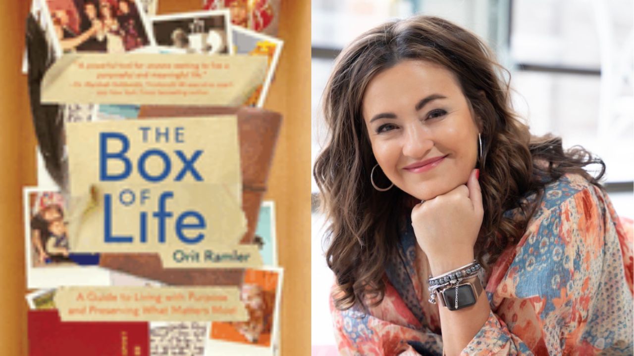 The image features a woman with curled brunette hair smiling while resting her chin on her hand, wearing a smartwatch and colorful patterned attire. Beside her, there is a book cover for "The Box of Life" by Orit Ramler, showcasing assorted photos and items. Fearrington Village