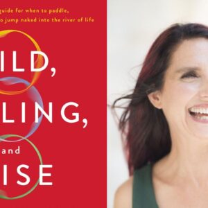 On the left side, a book cover with a red background titled "Wild, Willing, and Wise" with overlapping colored circles. A subtitle reads, "An interactive guide for when to paddle, when to rest, and when to jump naked into the river of life." On the right side, a woman with long dark hair and a wide smile is looking to the right, wearing a sleeveless top. Fearrington Village