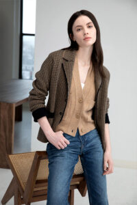 model wearing kinross cashmere cardigan and jacket