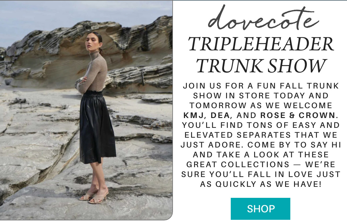 A woman stands confidently on a rocky shore, wearing a beige sweater and black leather skirt. The text beside her promotes a Dovecote Tripleheader Trunk Show, inviting shoppers to explore collections by KMJ, DEA, and Rose & Crown. A "Shop" button is included. Fearrington Village