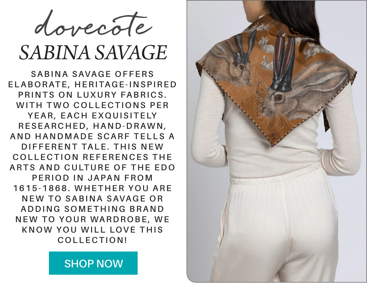 A woman wearing a brown and gold silk scarf with intricate heritage-inspired prints from Sabina Savage, shown from the back. Text beside her describes the scarf's Edo period inspiration and encourages shopping. Fearrington Village