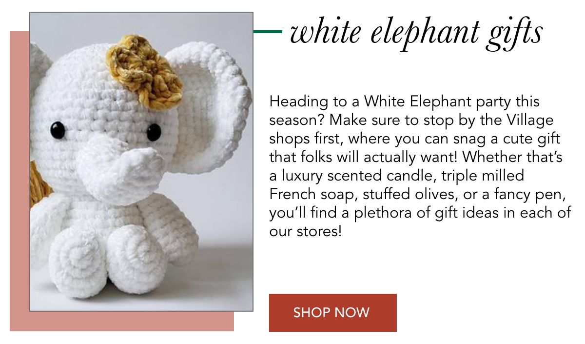 A crocheted plush elephant with a flower accessory is next to a promotional description for white elephant gifts. The text invites shoppers to find unique gift ideas like luxury soap and olives at local stores. A "Shop Now" button is included. Fearrington Village