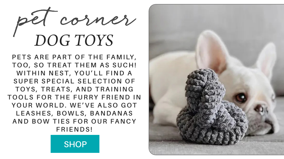 A French bulldog resting on a couch with a gray knitted toy. Text reads: "Pet Corner Dog Toys. Pets are part of the family... leashes, bowls, bandanas and bow ties for our fancy friends!" A teal button says "Shop. Fearrington Village