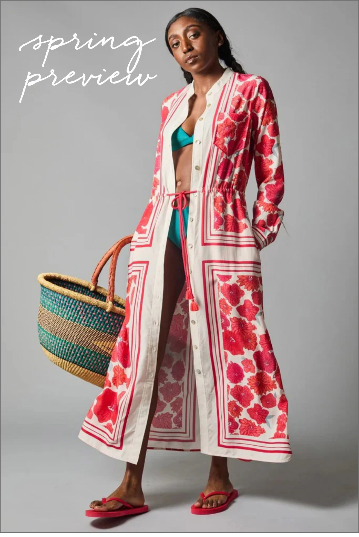 Woman posing in a long, patterned dress with red floral designs, partially unbuttoned to reveal a green swimsuit underneath. She carries a woven tote and wears red sandals. Text reads "spring preview" in the top-left corner. Fearrington Village