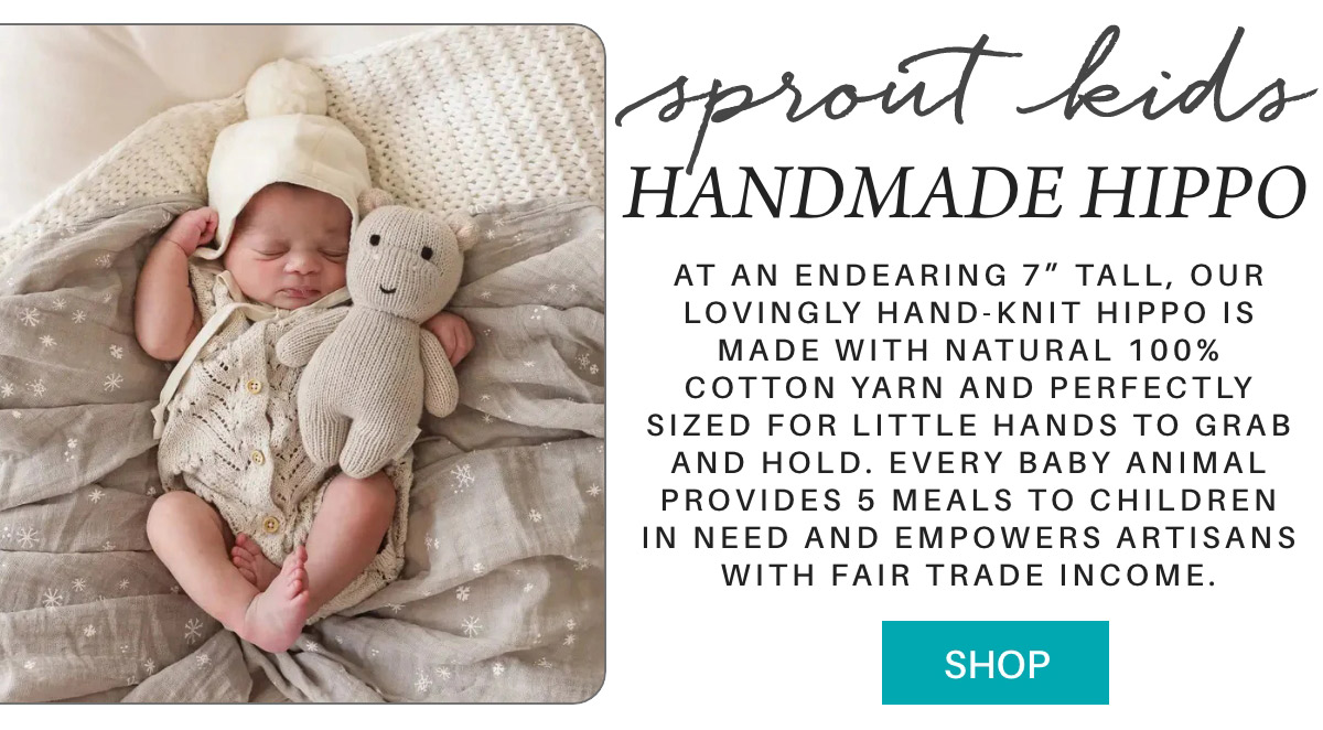 A sleeping baby cuddles a knitted hippo toy. Text describes the toy as 7 inches tall, made of 100% cotton yarn, benefiting children in need and supporting fair trade artisans. A "Shop" button is visible. Fearrington Village