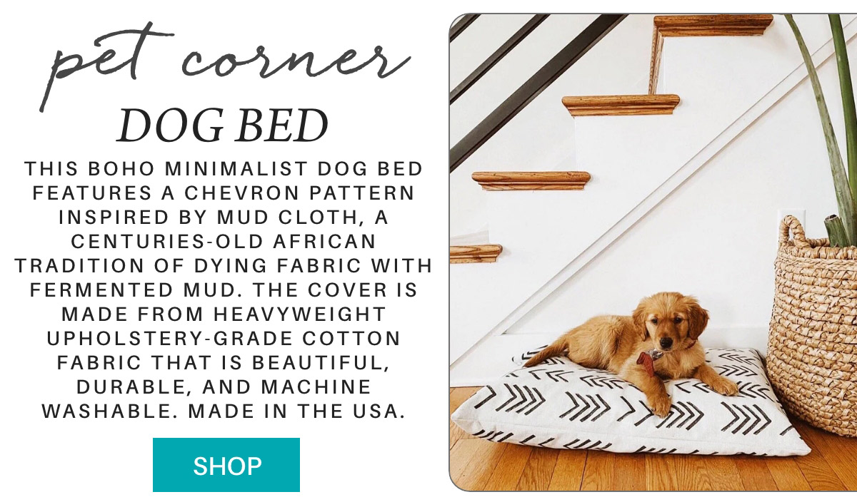 Golden retriever puppy lying on a chevron-patterned dog bed next to stairs. Text describes the boho minimalist design and features of the bed, highlighting its durability and machine washability. Made in the USA. "Shop" button below. Fearrington Village