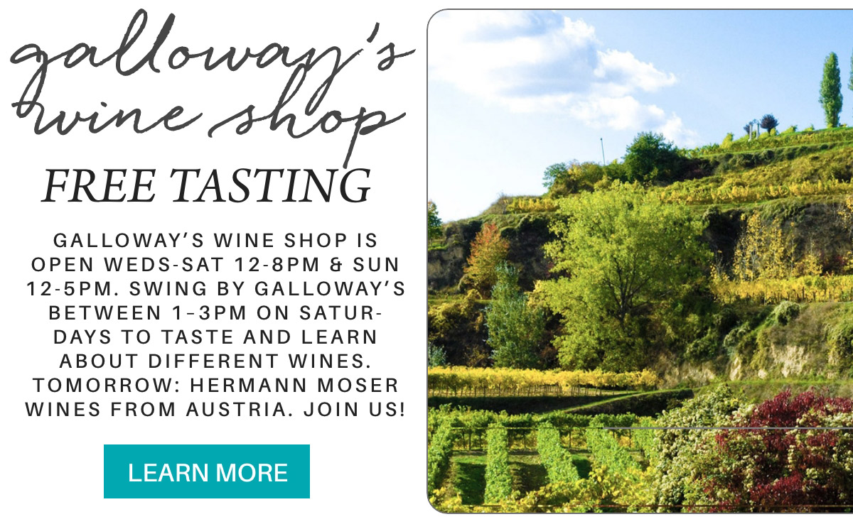 Image of a wine shop advertisement. Text: "galloway's wine shop FREE TASTING. Open Weds-Sat 12-8pm & Sun 12-5pm. Tastings Sat 1-3pm. Focus tomorrow: Hermann Moser wines from Austria." Background shows a hilly vineyard. Button reads: "LEARN MORE". Fearrington Village