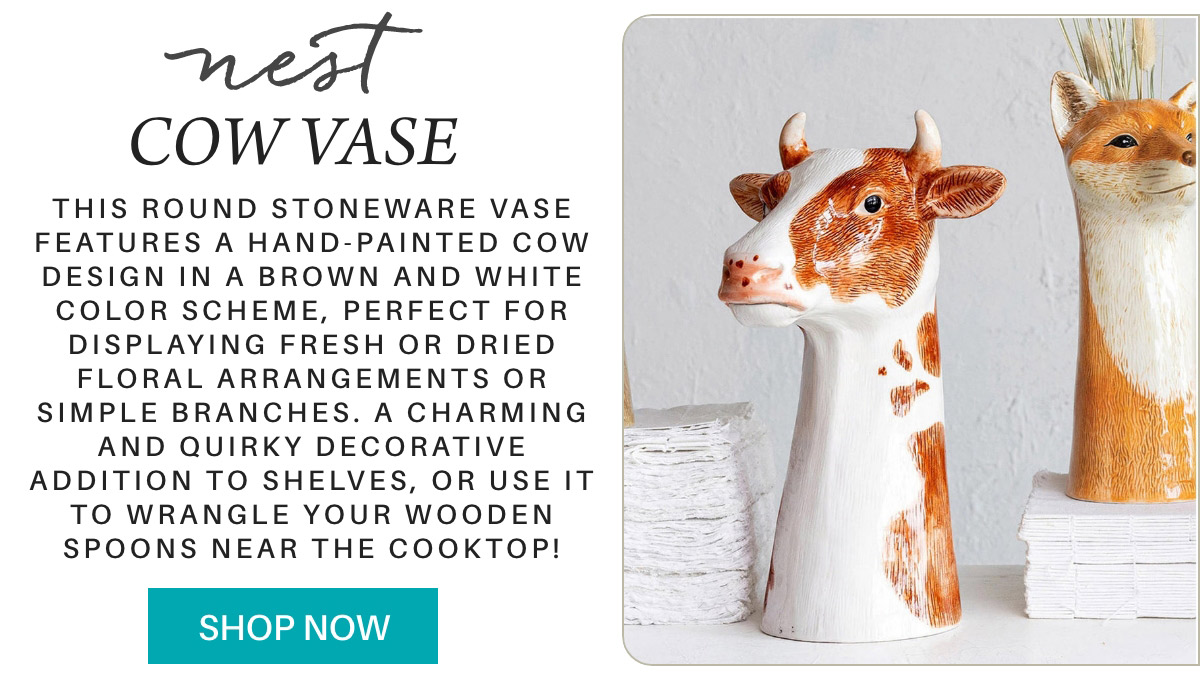 A decorative ad shows a round stoneware vase with a brown and white cow design. The text highlights its use for floral arrangements or kitchen utensils. A "SHOP NOW" button is at the bottom. Another vase with a different animal design is partially visible. Fearrington Village