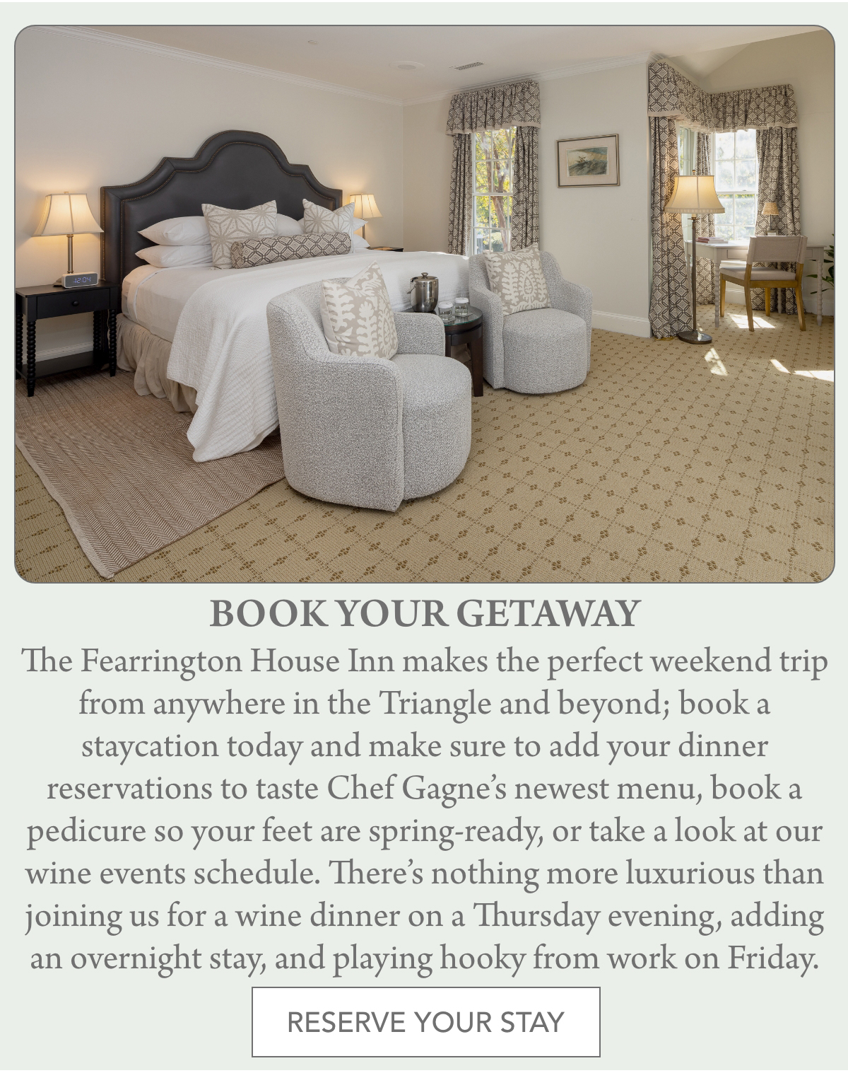 A luxurious bedroom at The Fearrington House Inn features a neatly made bed with plush pillows, two gray armchairs, a side table with a lamp, a large window with patterned curtains, and a soft carpet. Text promotes booking a stay and enjoying the amenities. Fearrington Village