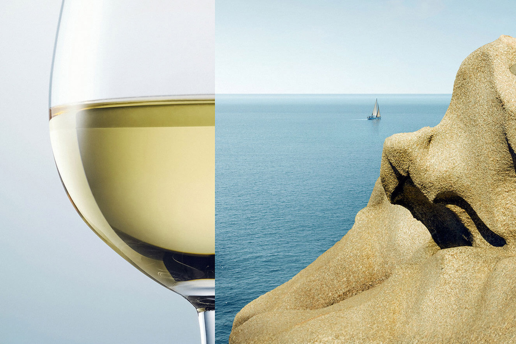 A glass of white wine on the left is visually aligned with a coastal rock formation and the ocean on the right, creating an artistic blend of the wine and sea. A small sailboat is visible on the horizon. Fearrington Village