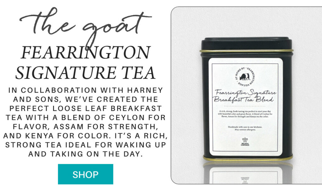 A tin of Fearrington Signature Breakfast Tea is featured with descriptive text about its blend and qualities, alongside a blue "Shop" button on a white background. "In collaboration with Harney and Sons, we’ve created the perfect loose leaf Breakfast Tea with A blend of Ceylon for flavor, Assam for strength, and Kenya for color. it’s a rich, strong tea ideal for waking up and taking on the day." Fearrington Village