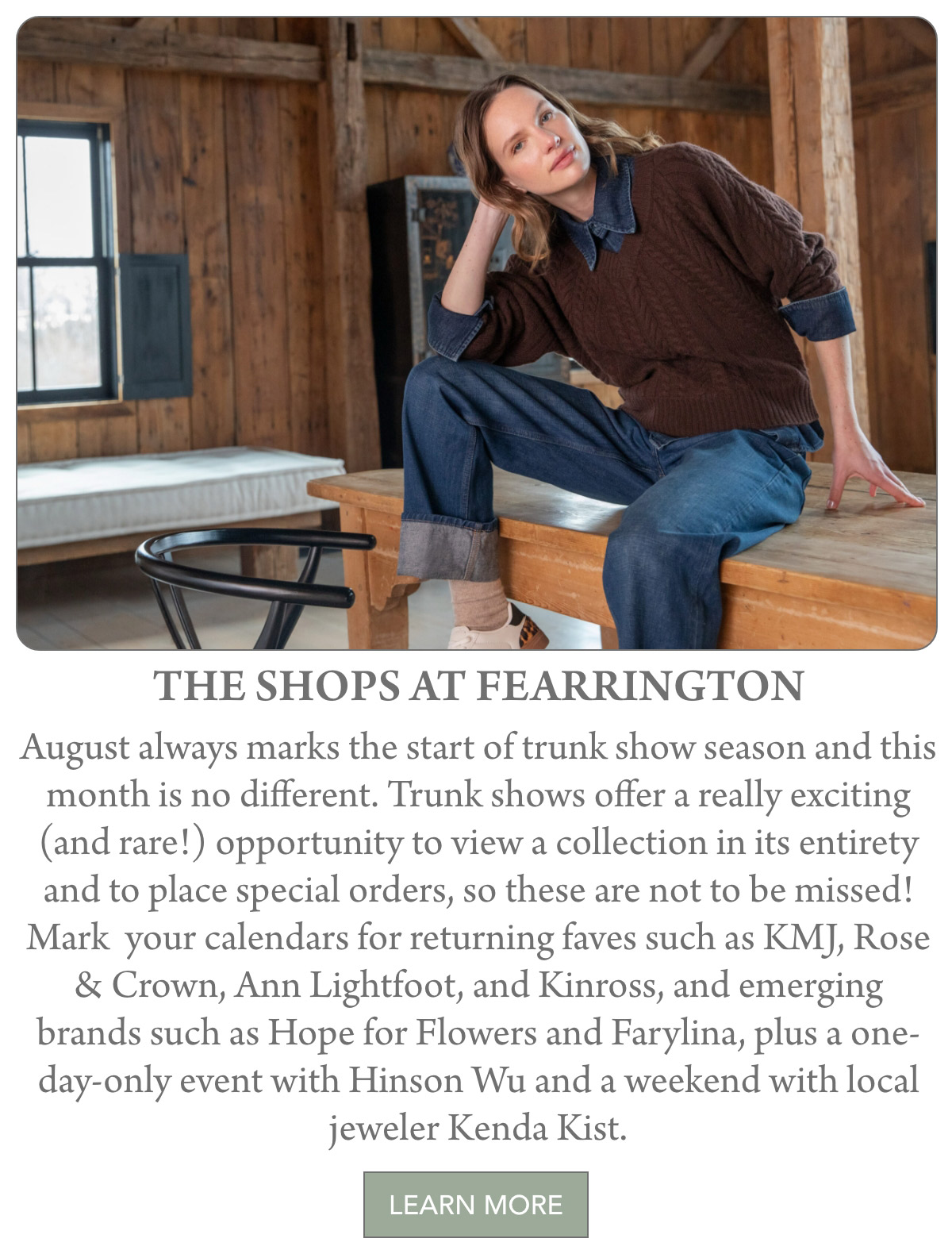 A woman in a brown sweater and blue jeans sits on a wooden table in a rustic room with exposed beams, looking relaxed. Text below announces upcoming trunk shows at The Shops at Fearrington. Fearrington Village
