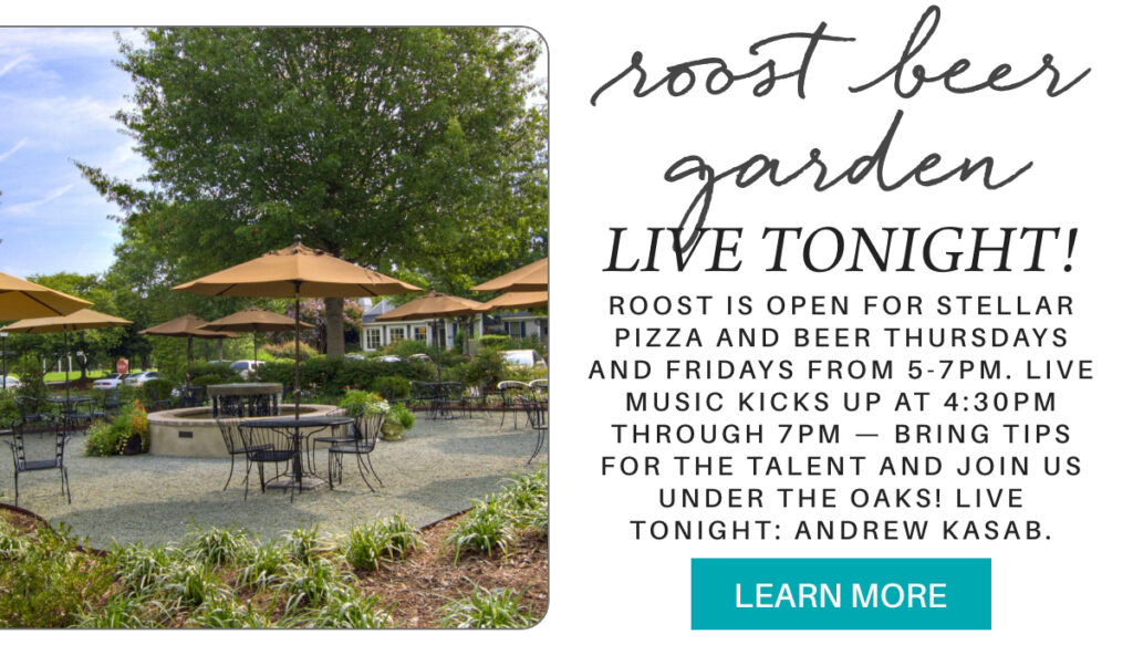 Outdoor beer garden with umbrella-covered tables under large trees, promoting live music and pizza nights. Text announces live music tonight at 4:30 pm and invites guests to relax under the oaks. "roost is open for stellar pizza and beer thursdays and fridays from 5-7pm. live music kicks up at 4:30pm through 7pm — bring tips for the talent and join us under the oaks! live tonight: andrew kasab." Fearrington Village