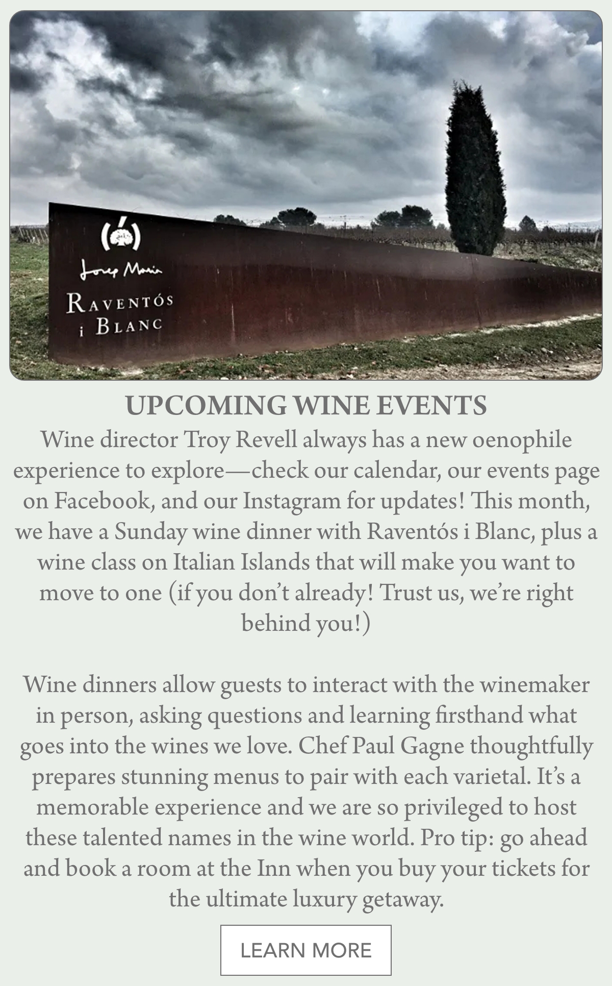 A wooden Raventós i Blanc sign stands on a grassy area in front of trees, with an announcement for upcoming wine events and details about wine dinners, classes, and ticket information below. Fearrington Village