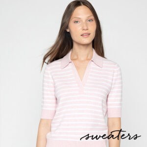 A woman with straight brown hair wears a light pink and white striped short-sleeve sweater with a collar. The word "sweaters" is written in cursive at the bottom right of the image. Fearrington Village