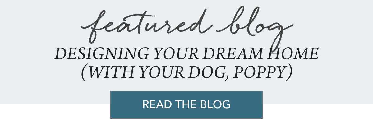 Four people sit around a table reviewing papers in a bright kitchen, while a small tan dog lies on a mat nearby. Text reads: “village life, August 2025, Designing Your Dream Home (With Your Dog, Poppy).”. Fearrington Village