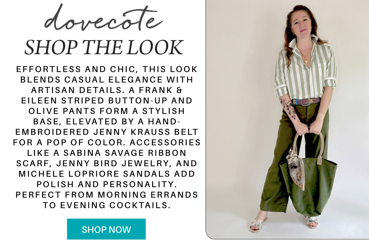 A woman in a striped button-up shirt and green pants stands holding a beige bag. She wears a colorful embroidered belt, sandals, and accessories, styled for casual elegance. Text describes the outfit and shopping options. "Effortless and chic, this look blends casual elegance with artisan details. A Frank & Eileen striped button-up and olive pants form a stylish base, elevated by a hand-embroidered Jenny Krauss belt for a pop of color. Accessories like a Sabina Savage ribbon scarf, Jenny Bird jewelry, and Michele Lopriore sandals add polish and personality. Perfect from morning errands to evening cocktails." Fearrington Village