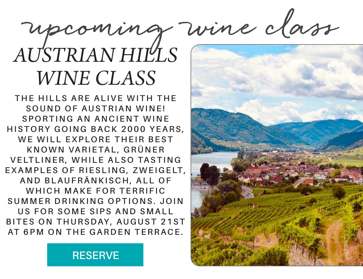 Promotional flyer for an Austrian Hills Wine Class, featuring text details and a scenic photo of an Austrian village by a river with hills and vineyards in the background. A teal "RESERVE" button is at the bottom. Fearrington Village