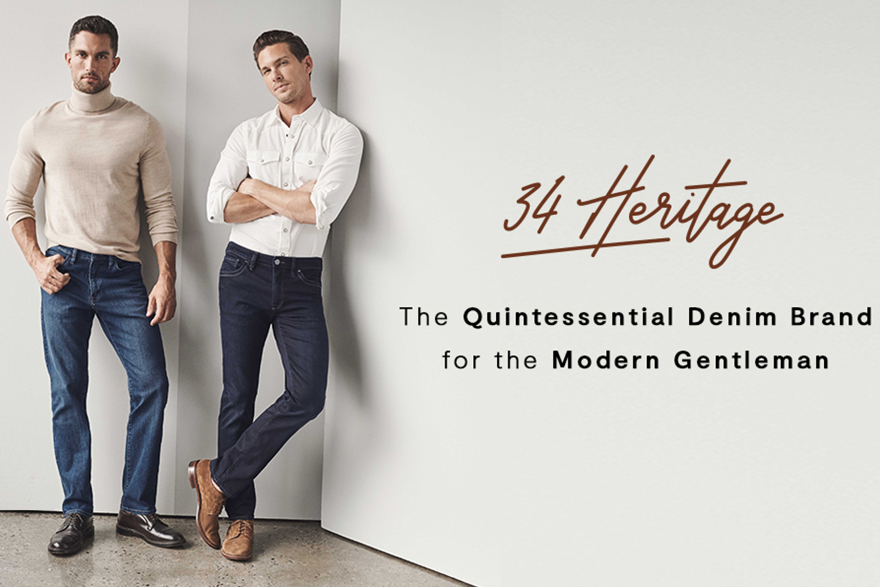 Two men in stylish denim jeans and casual tops pose against a light wall. Text reads: “34 Heritage. The Quintessential Denim Brand for the Modern Gentleman.”. Fearrington Village