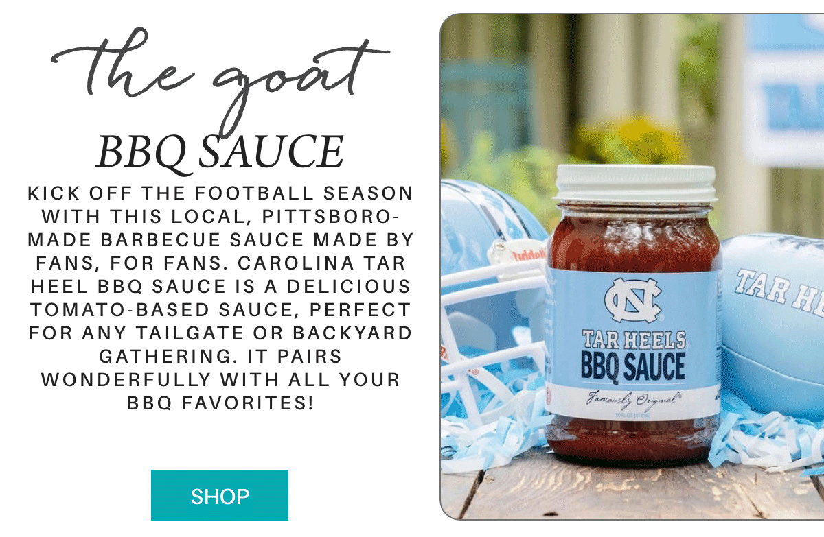 A promotional image for Tar Heels BBQ Sauce shows a jar of the sauce on a table with blue themed football items. Text promotes the sauce as perfect for tailgates and gatherings. A teal "Shop" button is at the bottom left. "Kick off the football season with this local, Pittsboro-made barbecue sauce made by fans, for fans. Carolina Tar Heel BBQ Sauce is a delicious tomato-based sauce, perfect for any tailgate or backyard gathering. It pairs wonderfully with all your BBQ favorites!" Fearrington Village
