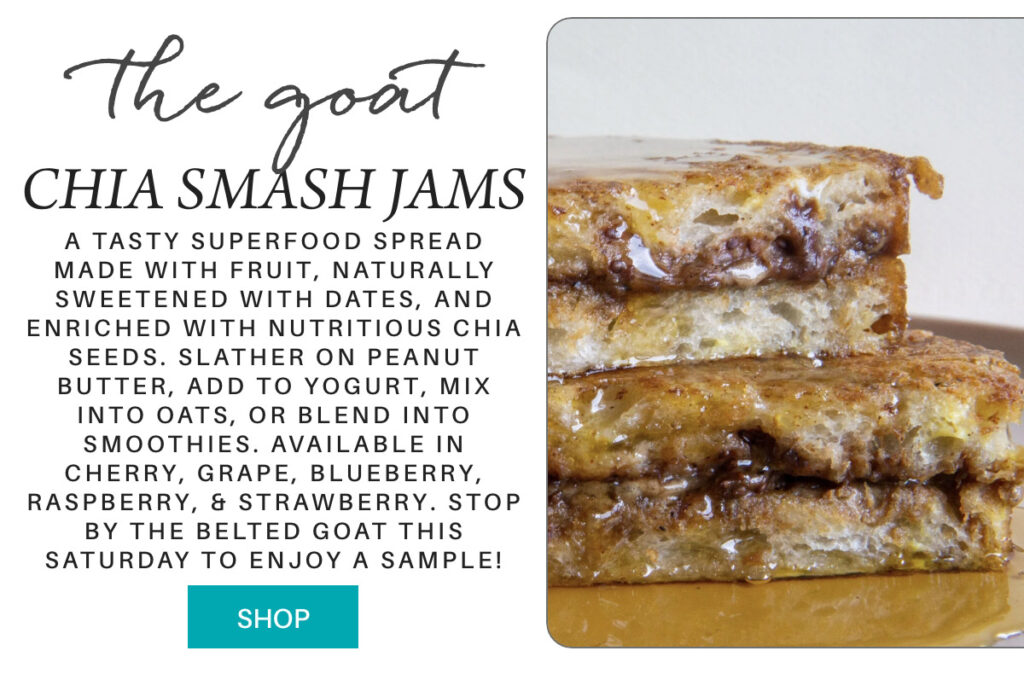 Advertisement for The Goat Chia Smash Jams, showing a close-up of toast with dark jam filling. Text describes the jam as fruit-based, naturally sweetened, with chia seeds, and available in multiple flavors. There is a “Shop” button. "A tasty superfood spread made with fruit, naturally sweetened with dates, and enriched with nutritious chia seeds. slather on peanut butter, add to yogurt, mix into oats, or blend into smoothies. Available in Cherry, Grape, Blueberry, Raspberry, & Strawberry. Stop by the Belted Goat this Saturday to enjoy a sample!" Fearrington Village
