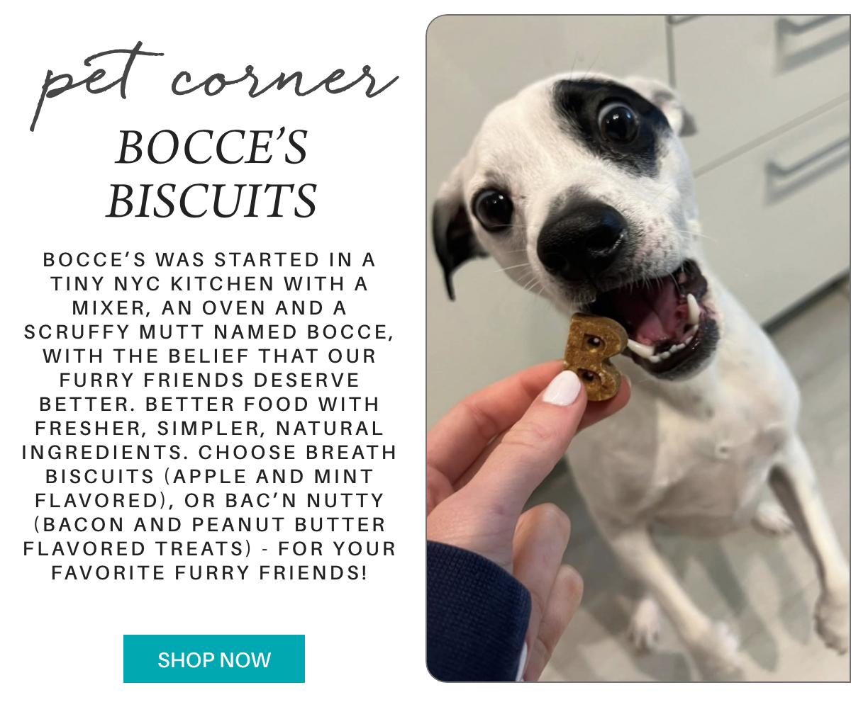 A small white dog with black ears excitedly opens its mouth as a hand offers it a bone-shaped biscuit with the letter "B" in front of a text about Bocce’s Biscuits, a natural pet treat brand. "Bocce’s was started in a tiny NYC kitchen with a mixer, an oven and a scruffy mutt named Bocce, with the belief that our furry friends deserve better. Better food with fresher, simpler, natural ingredients. choose breath biscuits (apple and mint flavored), or BAC’N NUTTY (bacon and peanut butter flavored treats) - for your favorite furry friends!" Fearrington Village