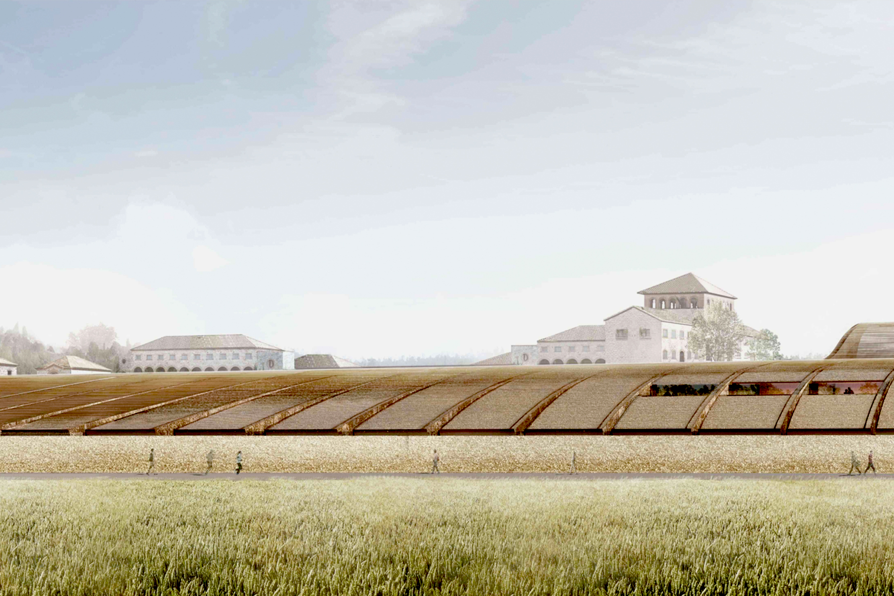 A wide, modern building with a curved, segmented roof sits in a grassy field, with several people walking in front of it and traditional-style buildings with tiled roofs visible in the background under a partly cloudy sky. Fearrington Village