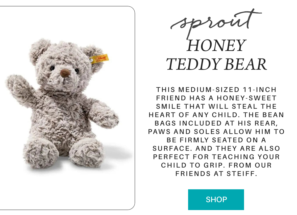 A fluffy gray teddy bear with a yellow tag in its ear sits upright. Text beside it describes the bear as a Steiff 11-inch "Honey Teddy Bear" with bean bags in its paws and soles, designed for children. A turquoise "SHOP" button is below. "This medium-sized 11-inch friend has a honey-sweet smile that will steal the heart of any child. The bean bags included at his rear, paws and soles allow him to be firmly seated on a surface. And they are also perfect for teaching your child to grip. from our friends at steiff." Fearrington Village